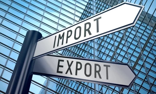 export-import-signpost-with-two-arrows-office-building-background